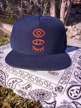 Load image into Gallery viewer, Navy Blue (five crown) Snap-Back W/ Burnt Orange Eyevate Eyecon
